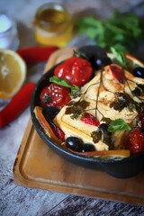 Baked feta with cherry tomatoes. Healthy food.