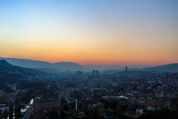 Naklejka na ściany i meble Colorful sky and sunset over Sarajevo. City of Sarajevo before night. Sarajevo, Bosnia and Herzegovina.