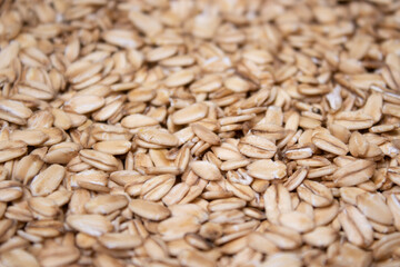 Macro Oatmeal texture. oat flakes food background. Healthy breakfast concept. Muesli cereals.