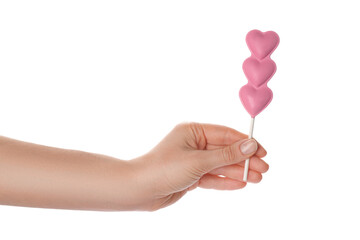 Woman holding heart shaped lollipops made of chocolate on white background, closeup