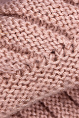 close-up of a pink knitted wool fabric background