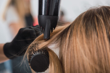closeup of hairdresser doing her client's hair