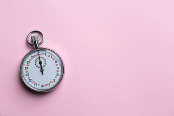 Vintage timer on pink background, top view. Space for text