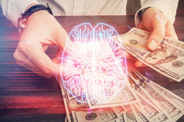 Multi exposure of brain drawing hologram and us dollars bills and man hands. Ai invest concept