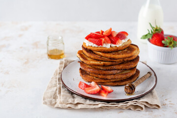 Stack of french toast with cottage cheese, honey and strawberries for breakfast. Selective focus