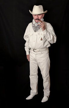  The cowboy with mustache in a white hat, smoking a cigar