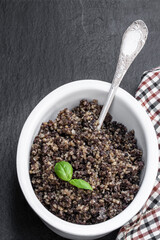 Traditional Scottish haggis on black stone background