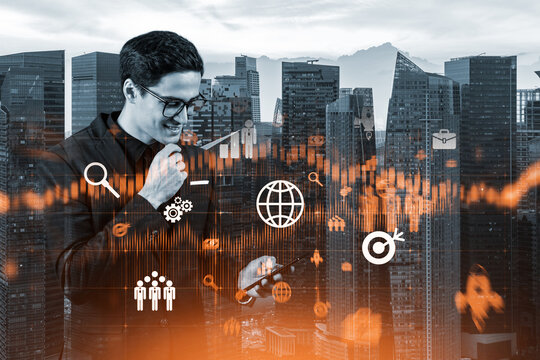 Eastern successful businessman trying to find new ideas using smartphone as a modern tool to solve problems at research and development department. Fintech hologram icons over Singapore.