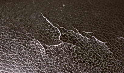 Cracked black leather on the office chair