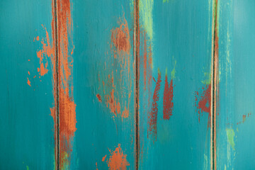 Boards painted with a brush in aqua color.