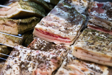 salted cooked pork belly on store counter