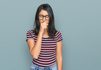 Beautiful asian young woman wearing casual clothes and glasses feeling unwell and coughing as symptom for cold or bronchitis. health care concept.