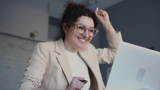 Positive girl feeling excitement sending job application, receiving good offer