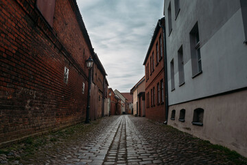 A small narrow alley in an old village in Beelitz, Brandenburg, Germany