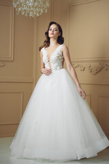 Fototapeta premium Beautiful sensual bride in light interior