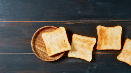 toasted bread slices on rustic wooden table