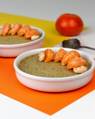 Traditional Sri Lankan coconut milk pudding Watalappan garnished with cashew nuts and tangerine wedges.