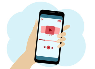 Hand with a mobile phone. There is a video player symbol in the phone