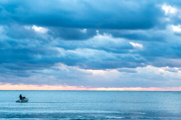 Fototapeta na wymiar Sunrise Sunset cloudy sky over the Atlantic Ocean in Fort Pierce small town in Florida east coast