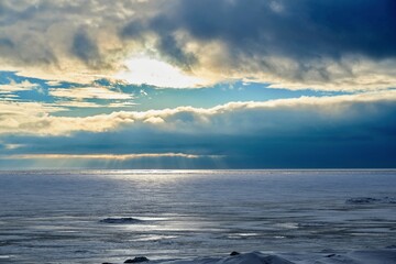 landscape of an icy lake and cloudy sky