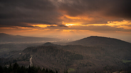 Dramatic sky over a valley in the black forest during the golden hour