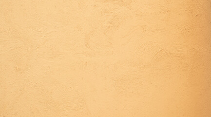 Yellow  textured stucco wall background. Yellow stucco wall. Background of a yellow stucco coated and painted exterior, rough cast of cement and. yellow background. abstract pastel wall grunge stone.