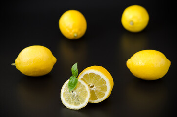 appetizing bright lemons on a black background contrasting colors Illuminating yellow on a black