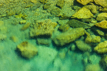 The stones under the pond, close-up as a background.