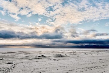 landscape of an icy lake and cloudy sky