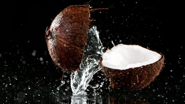 Super slow motion of falling cracked coconut
