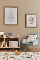 Cozy interior of child room with mint armchair, brown mock up poster frame, toys, teddy bear, plush animal, decoration and hanging cotton colorful balls. Beige wall. Warm kid space. Template.
