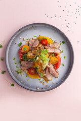 Duck and tomato salad.