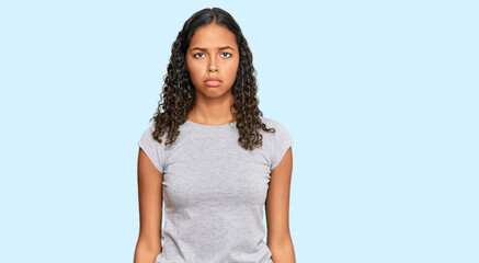Young african american girl wearing casual clothes depressed and worry for distress, crying angry...