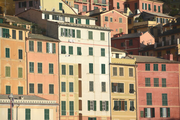 Naklejka premium Camogli is a typical seaside village and tourist center known for its marina, church and tall colorful buildings on the seafront.