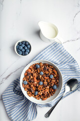 Chocolate granola, muesli with almonds, hazelnuts and blueberries