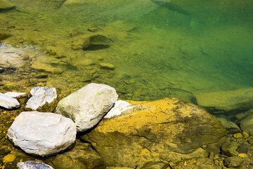 The stones under the pond, close-up as a background.