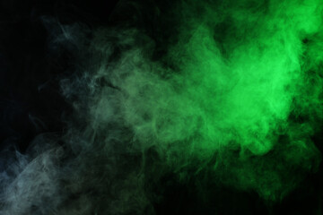 Smoke in red-green light on black background