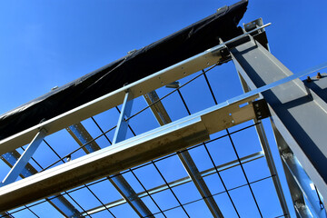 Low angle view of steel framing members for new commercial building.
