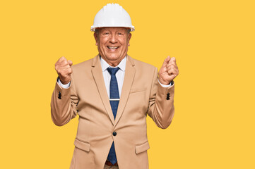 Senior caucasian man wearing architect hardhat screaming proud, celebrating victory and success very excited with raised arms