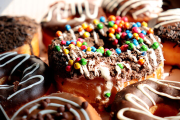 Fresh colorful donuts with sprinkles