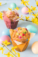 Muffins with colorful chocolate and Easter decoration, vertical