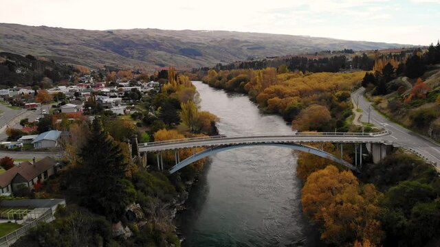 Van crossing the bridge during autumn, Roxburgh, Central Otago, New Zealand aerial