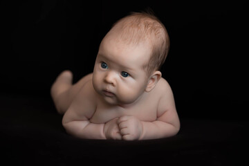 baby on black background
