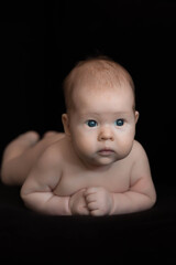 baby on black background
