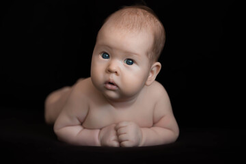 baby on black background