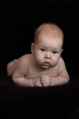 baby on black background