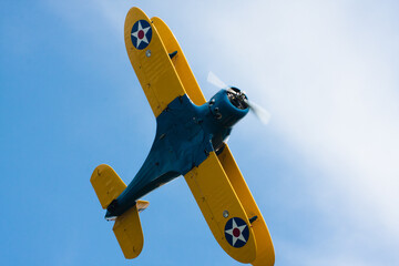 Blue and yellow biplane