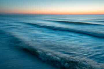 Sea at sunset with intentional camera movement, motion blur