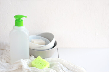 Fototapeta na wymiar Clean bowls and eco dishwashing liquid.