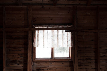 Fototapeta na wymiar Window in old wooden house with